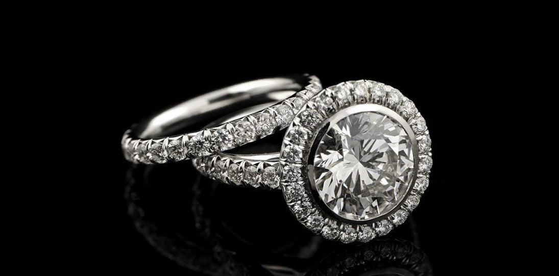 A unique engagement ring, this diamond ring is a custom jewerly design that has a large central stone.