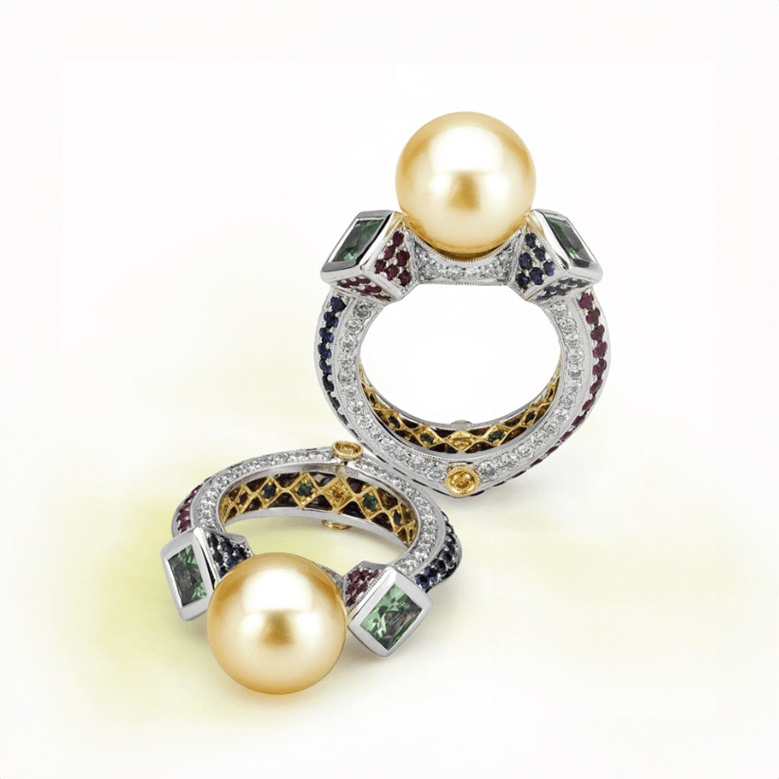 14k White and 18k Yellow Gold, pearl ring made by jewelry designer Garo Demirjian, featuring golden South Sea pearls and diamonds, accented with colored gemstones on a light background.