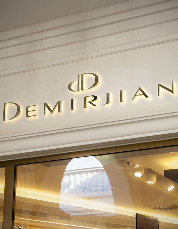 The illuminated exterior sign for Demirjian, a luxury fine jeweler located near Scottsdale and Phoenix.