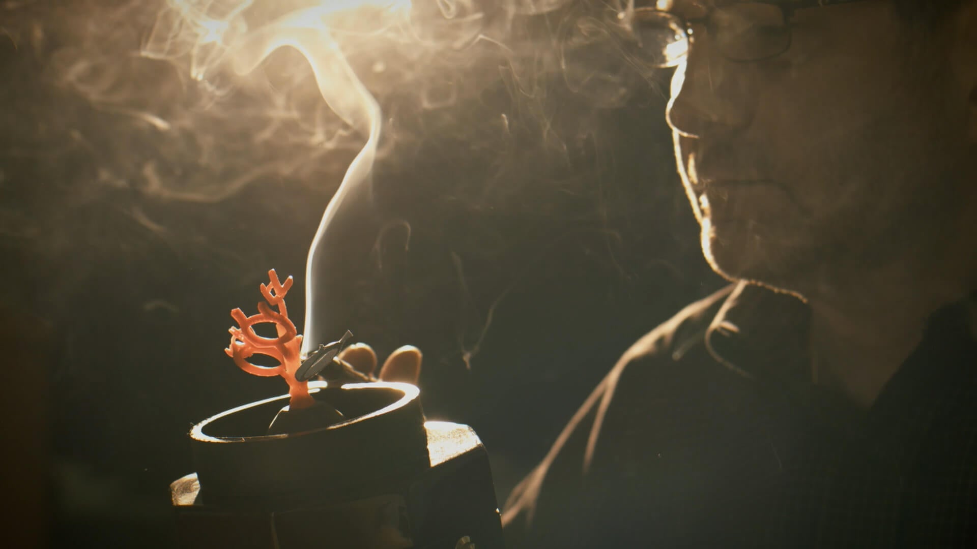 Image of Garo Demirjian using a jewelry wax tree for casting.